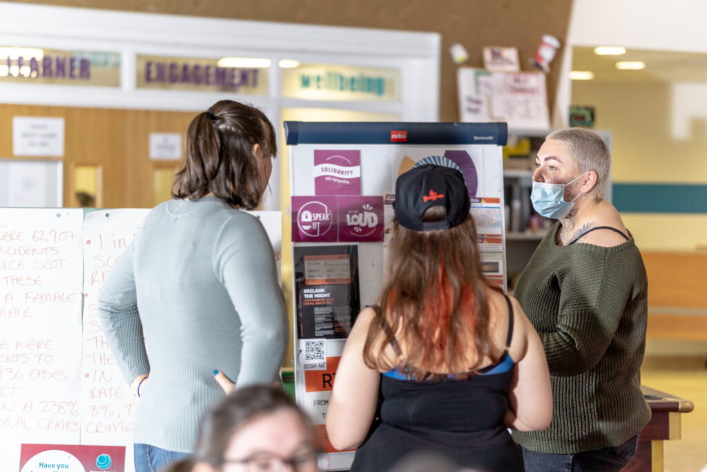 Students looking at a display